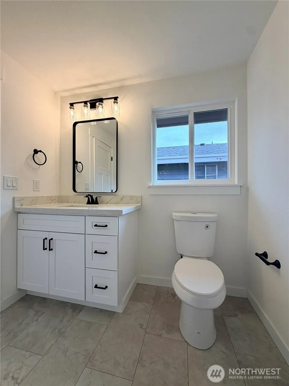 Bright bathroom with vanity and natural light